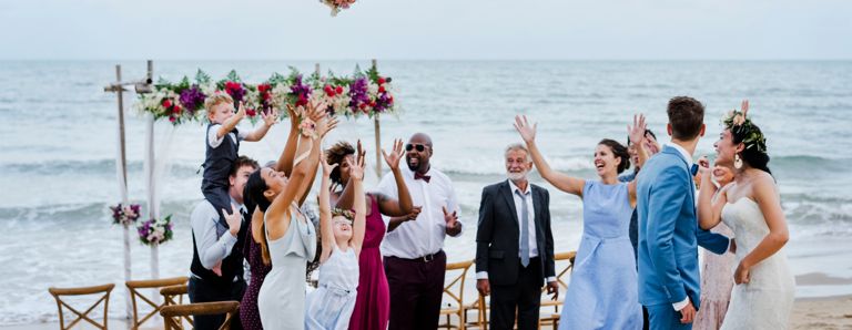 Bride throwing the bouquet at wedding